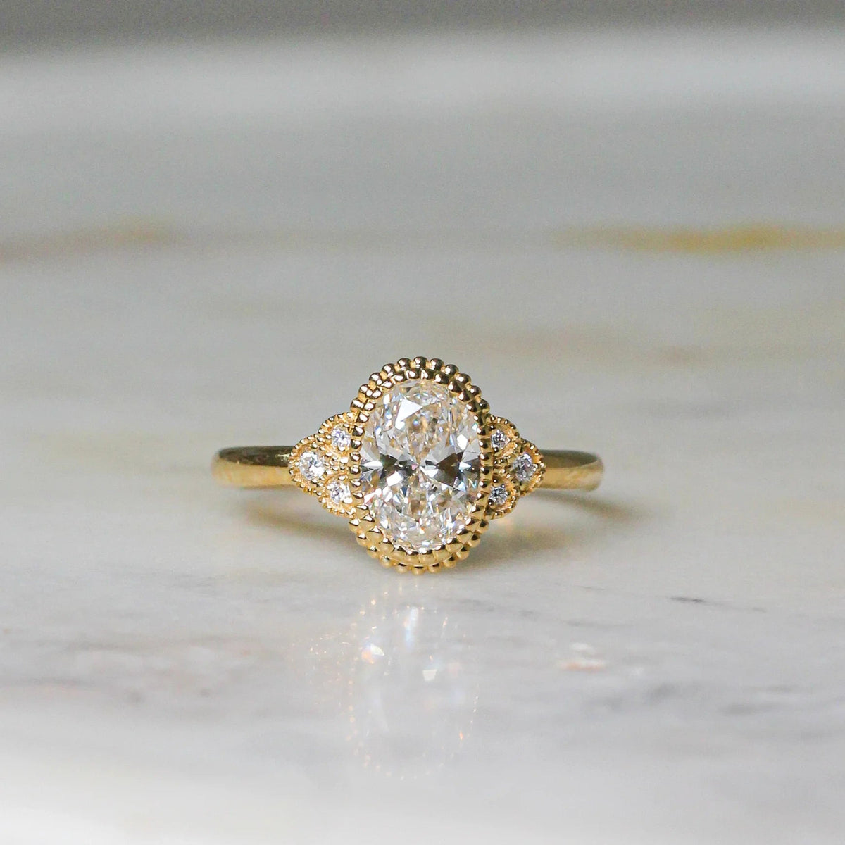 Vintage-inspired halo engagement ring with side a ROSE 10K