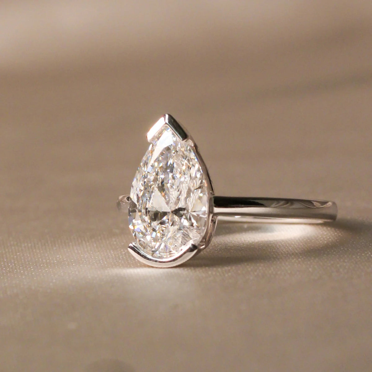 Modern V-Tip Pear Diamond Semi-Bezel Statement Rin View 2