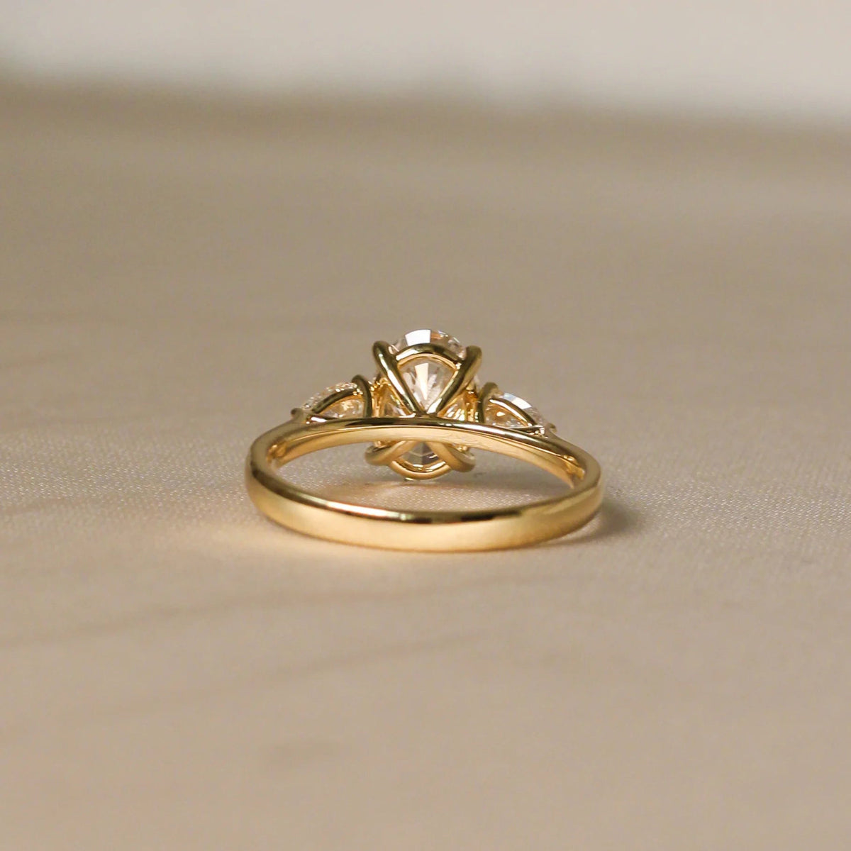 Oval Diamond Three-Stone Engagement Ring with Pear View 6
