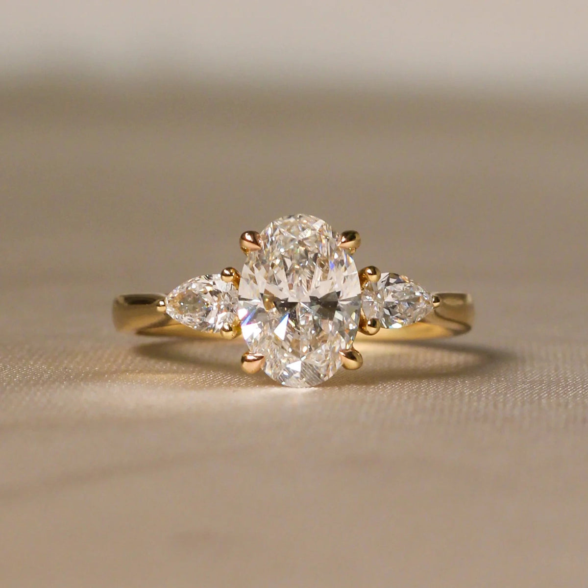 Oval Diamond Three-Stone Engagement Ring with Pear View 5