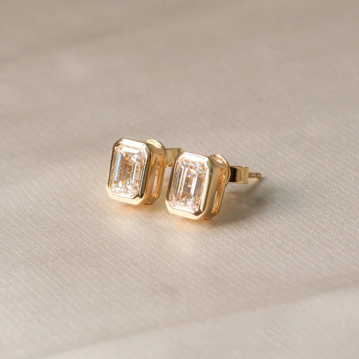 Modern Bezel Emerald Diamond Studs View 2