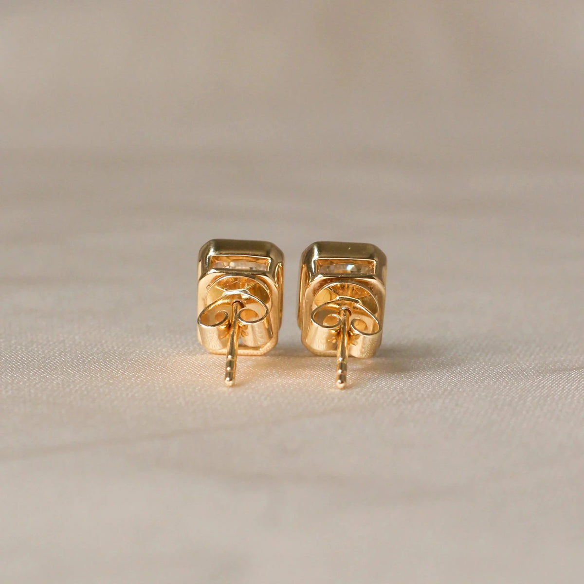 Modern Bezel Emerald Diamond Studs View 3