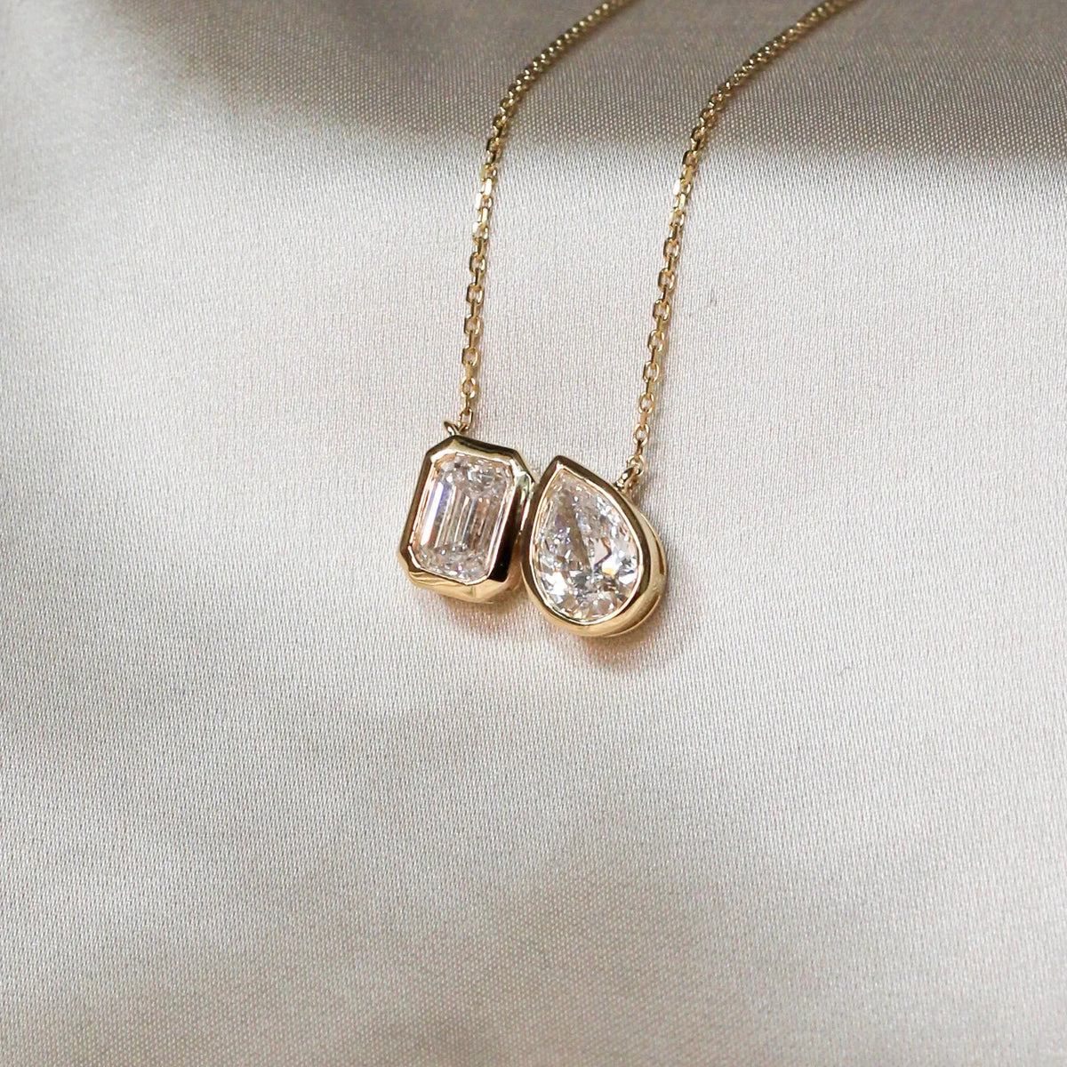 Modern Bezel-Set Emerald & Pear Diamond Toi et Moi View 4