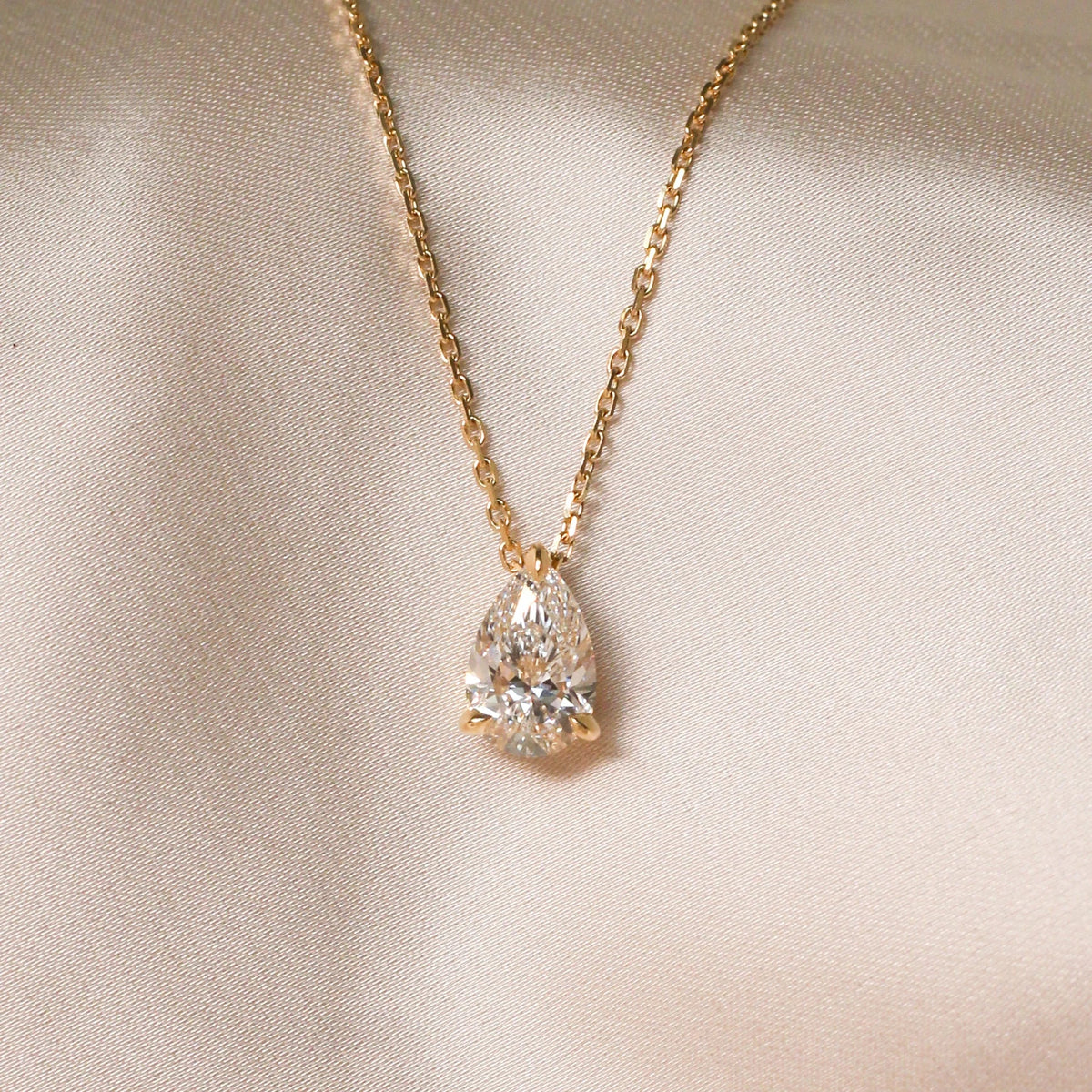 Modern Floating Pear Solitaire Diamond Necklace View 2