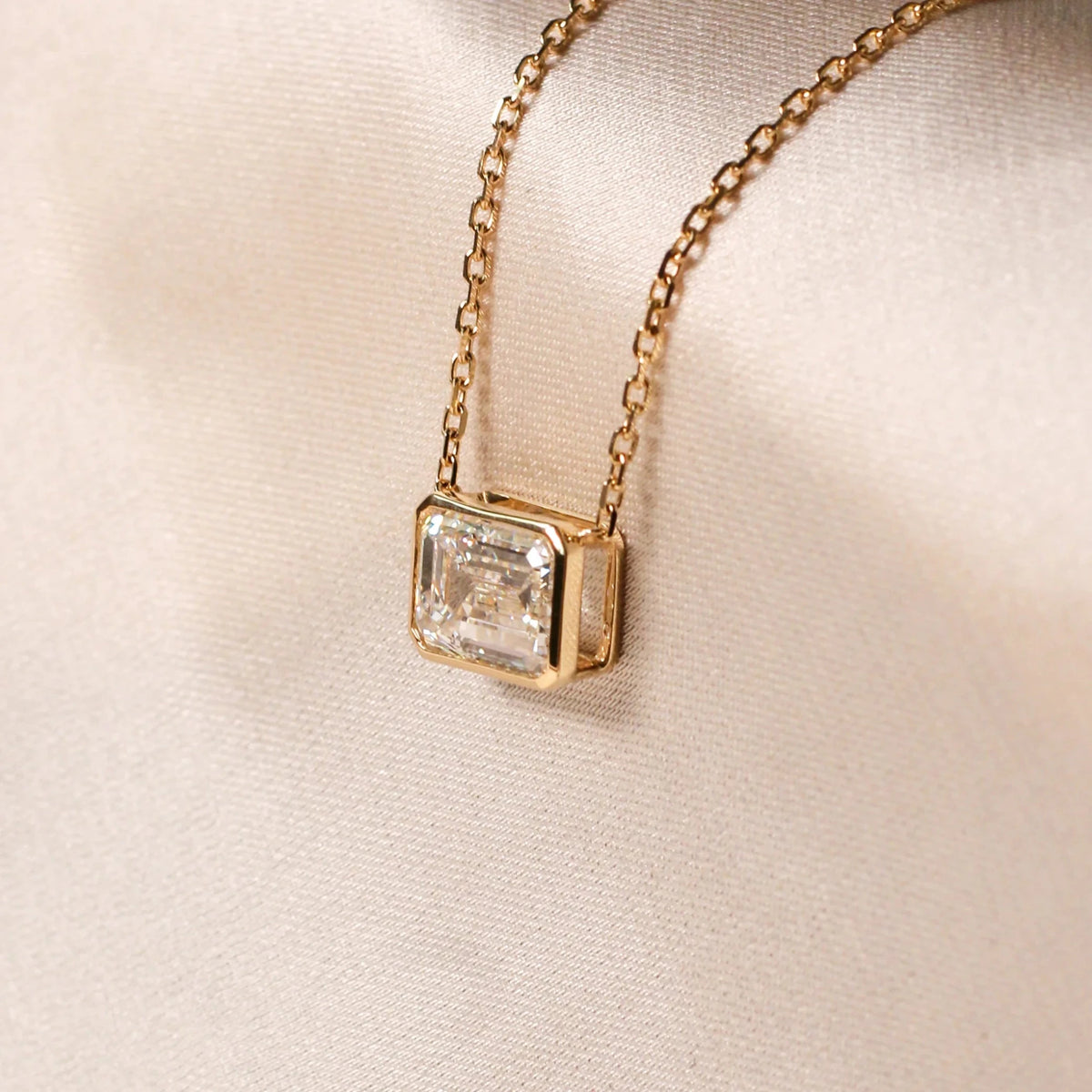 Emerald-Cut Diamond East-West Full-Bezel Solitaire View 5